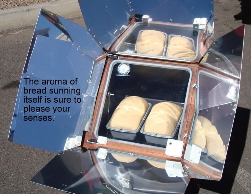 image of sun oven in use to explain what a solar oven is and how it works